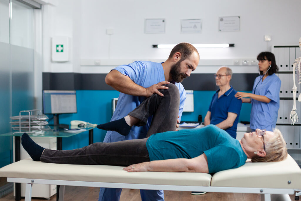 chiropractic specialist helping aged woman with le 2025 02 18 00 16 35 utc