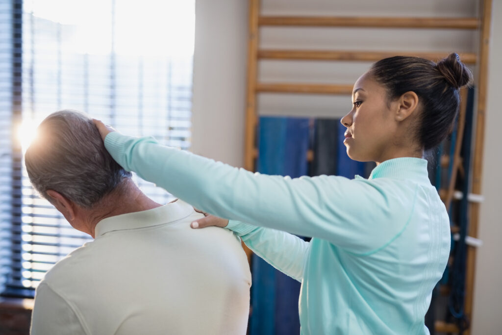 female therapist examining neck of senior male pat 2025 04 03 15 37 45 utc