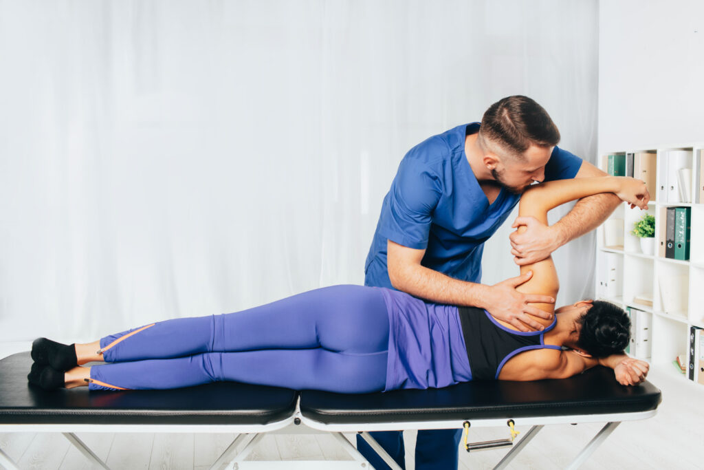 physiotherapist treatment patient his holding pat 2025 06 05 19 31 30 utc